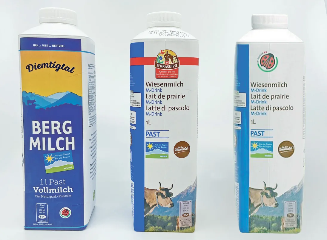 d83824331f5a91c57b1b33ebb45a0526cb07b6a9 Die Bergmilch und die künftige Wiesenmilch mit Käfer (r.). In der Mitte die alte Packung mit Terra-Suisse-Logo. (Bild akr/Screenshot)
